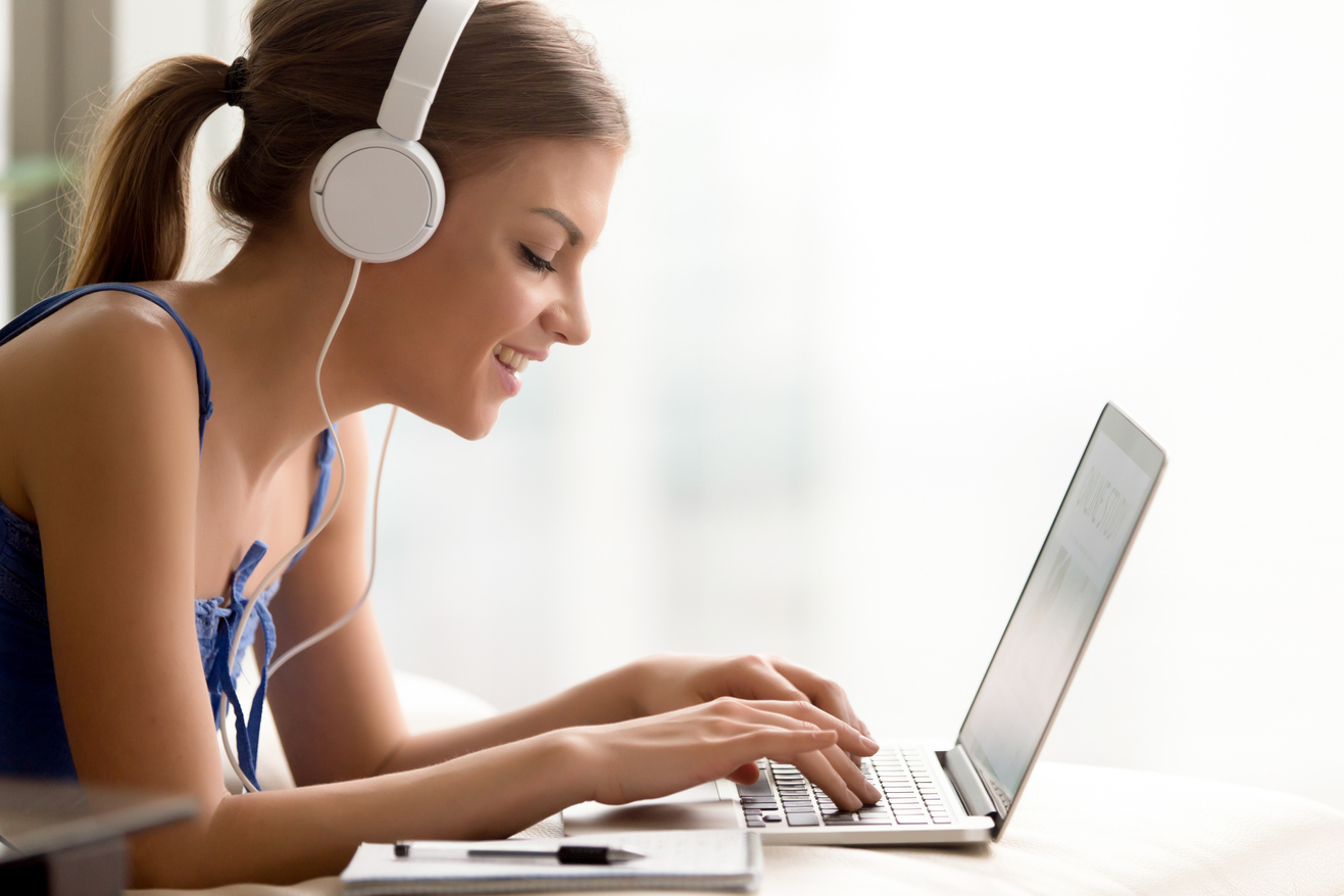 Woman headphones learning language online SMALL
